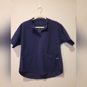 Used women's Figs scrub top. Size S. Navy color. "Ejura" style.